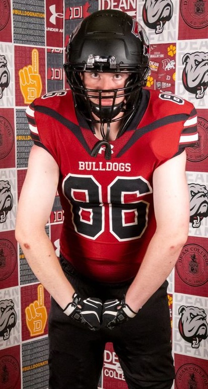 Eli Kestenbaum in a red football uniform wearing number 86 and a helmet; the original watermarked football artwork remains visible.
